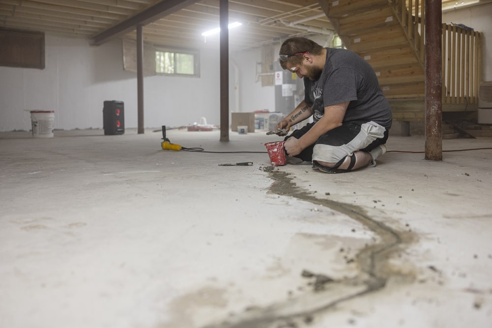 contractor-working-on-basement-floor